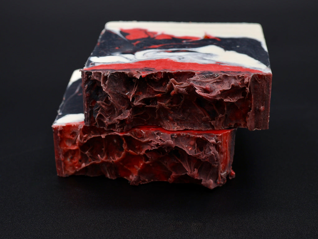 Voided Flesh soap stacked bars showing dramatic red, black and white swirls