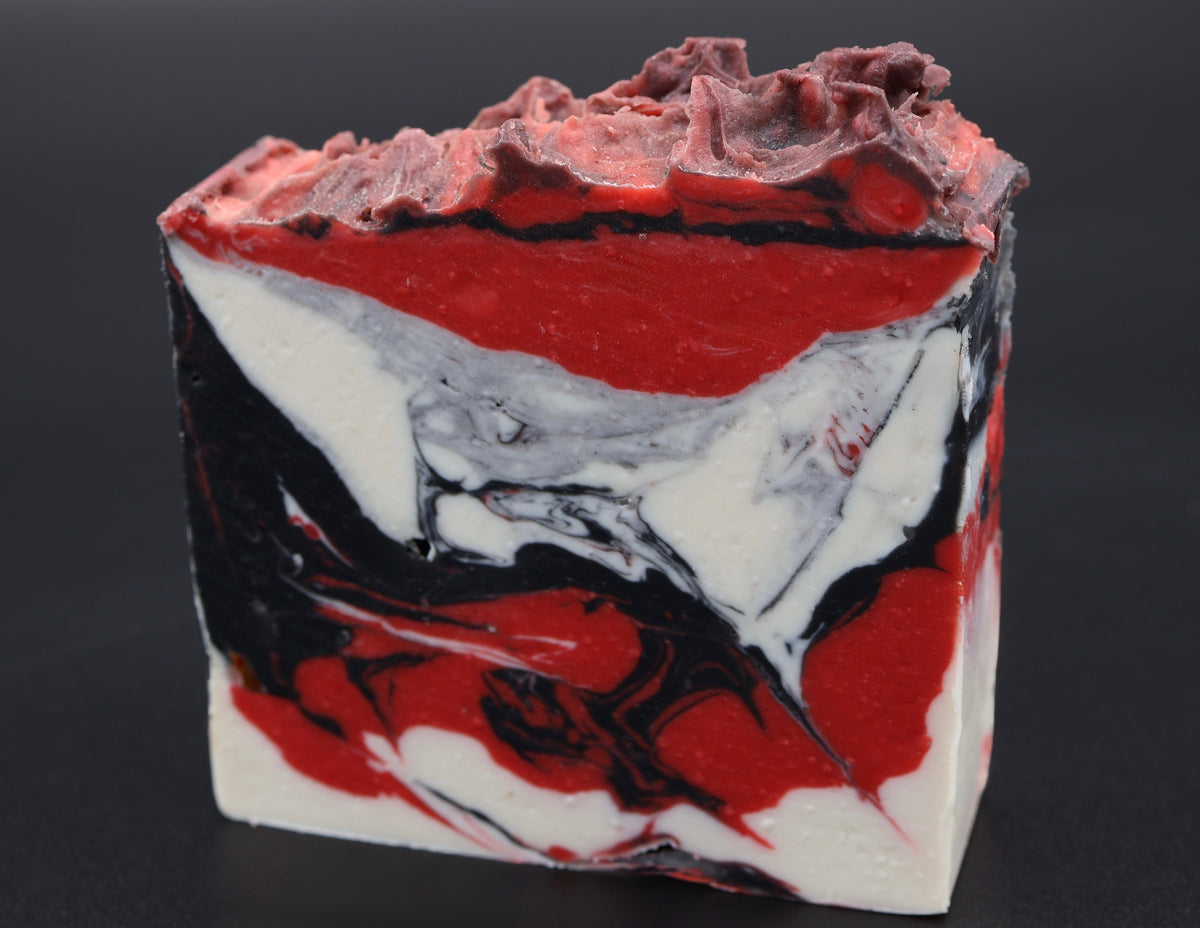 Voided Flesh soap side view showing layered red, white and black design