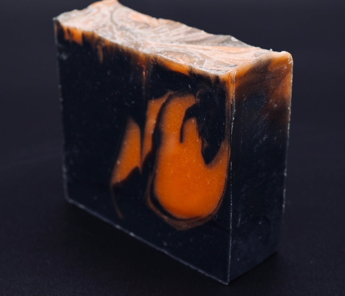 Tick-O-Treat soap three-quarter view showing textured top and bold Halloween color swirls